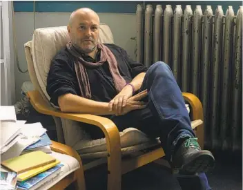  ?? JILLIAN FREYER NEW YORK TIMES ?? Colum Mccann, author of “Apeirogon,” in his office at Hunter College in New York.