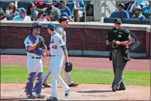  ?? JULIE JACOBSON/AP PHOTO ?? New York Mets starting pitcher Jacob deGrom (48) comments to catcher Devin Mesoraco after giving up a run to the San Francisco Giants during the third inning Thursday.