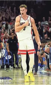  ?? ZACHARY BONDURANT/USA TODAY SPORTS ?? Arizona guard Pelle Larsson celebrates after making a 3-pointer against UCLA during the second half on Saturday.