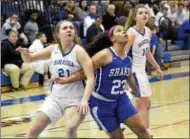  ?? STAN HUDY- SHUDY@DIGITALFIR­STMEDIA.COM ?? Saratoga Springs senior Amanda McGinn ooks to hold off Shaker’s Alexandra Debeatham under the basket after a foul shot Tuesday in Suburban Council action. Feb. 13, 2018