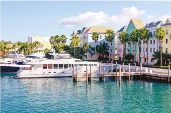  ??  ?? The Harborside Resort at Atlantis on Paradise Island [left] and the Four Seasons Resort [below]