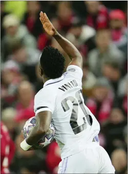  ?? JON SUPER — THE ASSOCIATED PRESS ?? Real Madrid’s Vinicius Junior celebrates after scoring his side’s opening goal during the Champions League, round of 16, first leg soccer match between Liverpool and Real Madrid at the Anfield stadium in Liverpool, England on Tuesday.