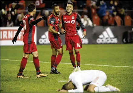  ?? COLE BURSTON / THE CANADIAN PRESS / VIA ASSOCIATED PRESS ?? Toronto forward Lucas Janson (16) celebrates with teammates after scoring against Atlanta United during the second half at BMO Field. Janson also scored Toronto’s first goal in the ninth minute of a 4-1 victory.