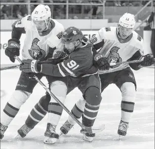  ?? CANADIAN PRESS FILE PHOTO/GEOFF ROBINS ?? In this Sept. 18, 2018 file photo, Toronto Maple Leafs’ centre John Tavares is checked by Ottawa Senators Logan Brown (left) and Ryan Dzingel an NHL pre-season game in Lucan, Ont. The Maple Leafs and Senators will play an exhibition game at Mile One Centre next September at the conclusion of Toronto’s training-camp stay in St. John’s.