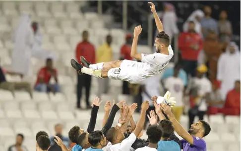  ?? PICTURES: Noushad Thekkayil ?? It’s all up in the air: Al Sadd’s Hassan al-Haydos gets some special treatment from his teammates after the team’s win over Al Duhail. At bottom, fans take a selfie with Baghdad Bounedjah.