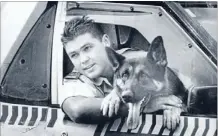  ??  ?? Partners against crime: Mark Mitchell in his days as a police dog handler, with Czar, the german shepherd. Both were stabbed by a man wielding a samurai sword.