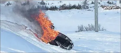  ?? SUBMITTED PHOTO ?? While snowmobili­ng on the Great Northern Peninsula on Tuesday, seven-year-old Ethan Sturge tipped over his snowmobile pinning his leg. Shortly after the machine caught on fire.