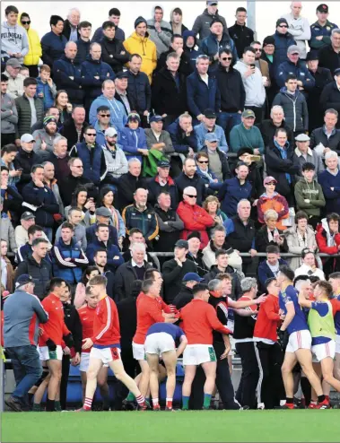  ??  ?? The massed brawl that broke out among players and mentors early in the second half of last Sunday’s FAR RIGHT: Dingle mentor Colm Geaney and East Kerry player Dara Moynihan involved in an incident