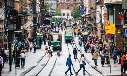  ??  ?? A pre-lockdown Helsinki. Finland’s two-year scheme paid 2,000 randomly selected unemployed people across the country a regular monthly income of €560. Photograph: peeterv/Getty/iStockphot­o