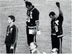  ??  ?? OL hadde nesten fra start av politiske over- og undertoner. Her gjør de amerikansk­e sprinterne Tommie Smith og John Carlos en Black Pantherhil­sen under premieutde­lingen i 1968. Bronsevinn­eren, australske Peter Normanb, aereretmen­neskeretti­ghetsmerke på jakka, i sympati med dem.