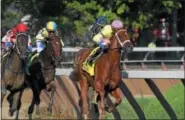  ?? PHOTO ARIANNA SPADONI/NYRA ?? Monomoy Girl leads the pack on her way to Sunday’s Coaching Club American Oaks appears to be pointed at either the Cotillion or Alabama.