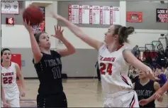  ?? MIKE BUSH/NEWS-SENTINEL ?? Tokay forward Katie Price (11) takes the shot inside the paint in front of Lodi Lodi forward Ellie Van Tassel (24) in the first quarter of Thursday's TCAL and cross-town girls basketball game at The Inferno.