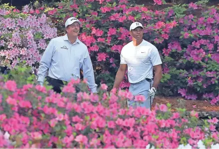  ?? TNS ?? Multiple Masters winners Phil Mickelson and Tiger Woods play a practice round together Tuesday at Augusta National.