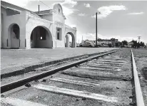  ??  ?? ABOVE IN 1991: The then-abandoned railroad depot and track in the Railyard. New Mexican file photo