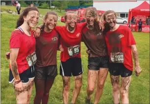  ?? Photo by Jonathan Bissonnett­e ?? North Smithfield friends Ellie Strong, Emelie Mandeville, Jessica Karspeck, Calla Puccetti and Janie Wilkes are all smiles despite being caked in mud at the conclusion of the Reviver Challenge, held on Saturday at the MacColl YMCA in Lincoln.
