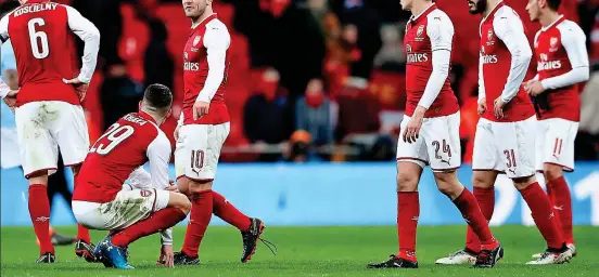  ?? PA ?? Wembley weaklings: Wilshere (10) and his Arsenal team-mates look utterly dejected after their Carabao Cup final surrender