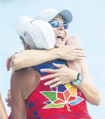  ?? BOB TYMCZYSZYN/POSTMEDIA NEWS ?? Women's quad masters winners in event 11 Vanessa Moors, right, and Marion Markarian from St. Catharines Rowing Club celebrate at the 135th Royal Canadian Henley Regatta Sunday in St. Catharines.