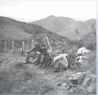  ??  ?? Searchers grab a breather at Opo¯nae, ¯ near Opo¯tiki, ¯ while looking for Peter Boland in 1957.