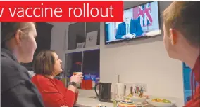  ?? Photo: Nampa/AFP ?? Closing up… A family gather around the television in Liverpool, north west England to watch Britain’s Prime Minister Boris Johnson give a televised message to the nation from 10 Downing Street in London.