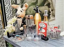  ??  ?? Bar items, including pieces from the Playboy Clubs, are shown at the entry at Michael Hopkins’ home.