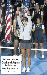 ?? / GETTY IMAGES ?? Winner Naomi Osaka of Japan, hoists her trophy.