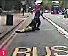  ?? ?? Hauled off: Pankiewicz drags his victim into a bus lane.. 1