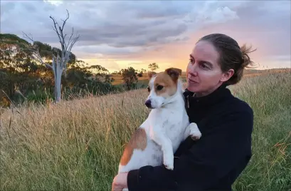  ?? ?? Author Norann Voll with her dog Bear at the Danthonia Bruderhof community in the Australian bush.