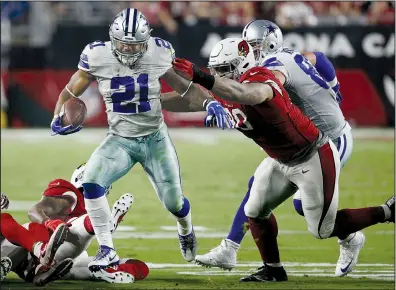  ?? AP/ROSS D. FRANKLIN ?? Dallas Cowboys running back Ezekiel Elliott (21) rushed for 80 yards and a touchdown as the Cowboys defeated the Arizona Cardinals 28-17 Monday night in Glendale, Ariz. Elliott’s 8-yard touchdown run with 1:38 left sealed the outcome.