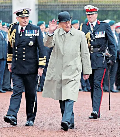  ??  ?? The Duke of Edinburgh waves farewell at a parade to mark the finale of the Royal Marines 1664 Global Challenge