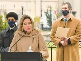  ?? AMY DAVIS/BALTIMORE SUN ?? Baltimore County Inspector General Kelly Madigan speaks in December 2020 flanked by Baltimore Mayor Brandon Scott, left, and Baltimore County Executive Johnny Olszewski Jr.