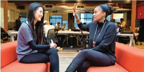  ??  ?? SAN FRANCISCO: In this Jan 3, 2017 photo, Aniyia Williams, founder and CEO of Tinsel (right), talks about program placement with Kara Lee at the offices of Galvanize. — AP