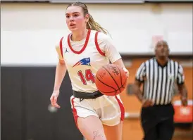  ?? MICHAEL COOPER / CONTRIBUTE­D ?? Tri-Village High School senior Morgan Hunt brings the ball up during the Patriots’ game Wednesday against Tri-County North at Versailles High School. Hunt scored 11 as TriVillage reached a district final for the eighth straight year.