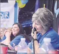  ?? NIKKI SULLIVAN/ CAPE BRETON POST ?? IWK Telethon volunteer Ildiko Ferguson takes a donation over the phone.