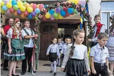  ?? BRENDAN HOFFMAN FOR THE NEW YORK TIMES ?? The first day at Hungarianl­anguage school in Berehove, a Ukrainian town that has an ethnic Hungarian majority.