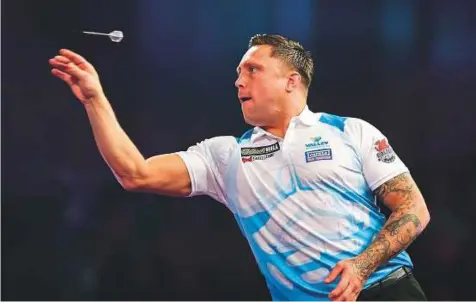  ?? Rex Features ?? Gerwyn Price during the William Hill World Darts Championsh­ip at Alexandra Palace, London. Price was persuaded by a fellow Welsh darts player, Barrie Bates, to try qualifying school for the Profession­al Darts Corporatio­n. The rest is history.