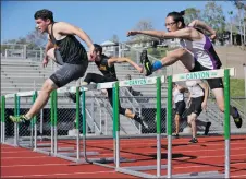  ?? Katharine Lotze/The Signal (See additional photos at signalscv.com) ?? Valencia and Canyon hurdlers go toe-to-toe during a dual track meet at Canyon on Thursday.