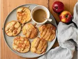  ??  ?? Above left: Apple & ricotta hotcakes with coconut caramel sauce. Above right: Baked apples with date crumble.