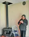  ?? PHOTO/DUNCAN BROWN ?? HOT DRINK: Aera Kani with a long awaited cup of coffee. She was boiling the jug when a chimney fire broke out in her home yesterday morning.