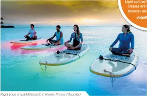  ??  ?? Night yoga on paddleboar­ds in Hawaii. Photos / Supplied