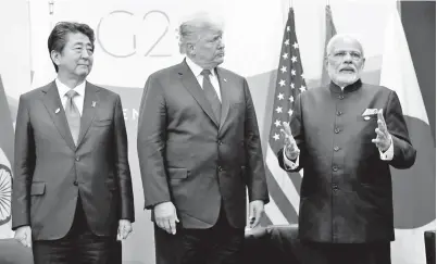  ??  ?? TRUMP (tengah) berjumpa dengan Abe (kiri) dan Modi semasa persidanga­n G20 bagi kuasa ekonomi di Buenos Aires, Argentina kelmarin. — Gambar Reuters