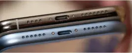  ??  ?? The Lightning port on the iphone XR (bottom) is slightly off-center as compared to the iphone XS Max.