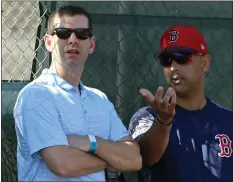  ?? HERALD STAFF FILE ?? GREEN WITH ENVY: Celtics’ GM Brad Stevens, left, talks with Red Sox manager Alex Cora during a spring training workout in 2019.