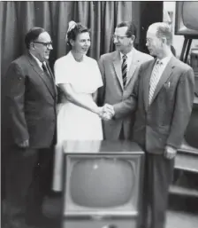  ?? Galt Archives photo 1976020908­0 ?? Kiwanis Club members present a television to the Raymond Hospital in 1957. Pictured are Miss E. A. Birt, matron of the Provincial Auxiliary Hospital at Raymond; Mr. L. J. Saunders, Kiwanis member on the Mental Health Committee; Dr. D. J. McCutchan, president of the Kiwanis Club; and Dr. John Bower.