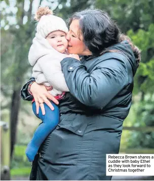  ??  ?? Rebecca Brown shares a cuddle with baby Ethel as they look forward to Christmas together