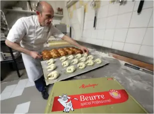  ?? (Eric Gaillard/Reuters) ?? FREDERIC ROY prepares all-butter croissants at his bakery in Nice yesterday. He is calling for the government to create a ‘traditiona­l’ label for croissants baked on the premises with additive-free flour and high-quality local butter.
