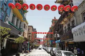  ?? ERIC RISBERG / AP ?? Lanterns hang in San Francisco’s Chinatown last month are an example of how Asian American enclaves across the U.S. are using art and culture to show they are safe and vibrant hubs nearly three years after the start of the pandemic.