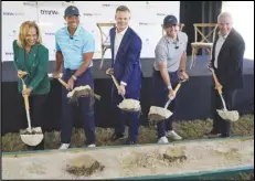  ?? Associated Press ?? Golfers Tiger Woods (second from left) and Rory McIlroy (second from right) join others in breaking ground for the future home of a new tech-infused golf league, Tuesday, on the campus of Palm Beach State College in Palm Beach Gardens, Fla. Others from left, Palm Beach State College President Ava Parker, TMRW Sports founder and CEO Mike McCarley and PGA Tour Commission­er Jay Monahan.