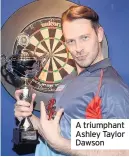  ??  ?? A triumphant Ashley Taylor Dawson