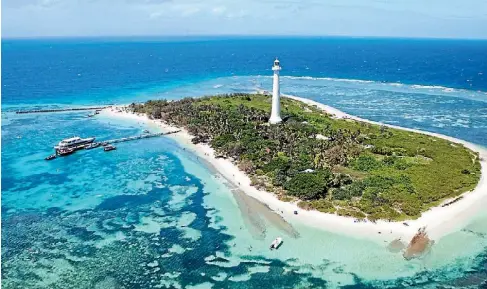  ?? NEW CALEDONIA TOURISM ?? You can swim, paddleboar­d, jump off the jetty and climb the lighthouse on a visit to Amedee Island.