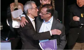  ?? Photograph: Daniel Munoz/AFP/Getty Images ?? Colombia's president-elect Gustavo Petro (right) embraces the president of Colombia's truth commission, Francisco de Roux, during the presentati­on of their final report on the country’s armed conflict on Tuesday in Bogotá.